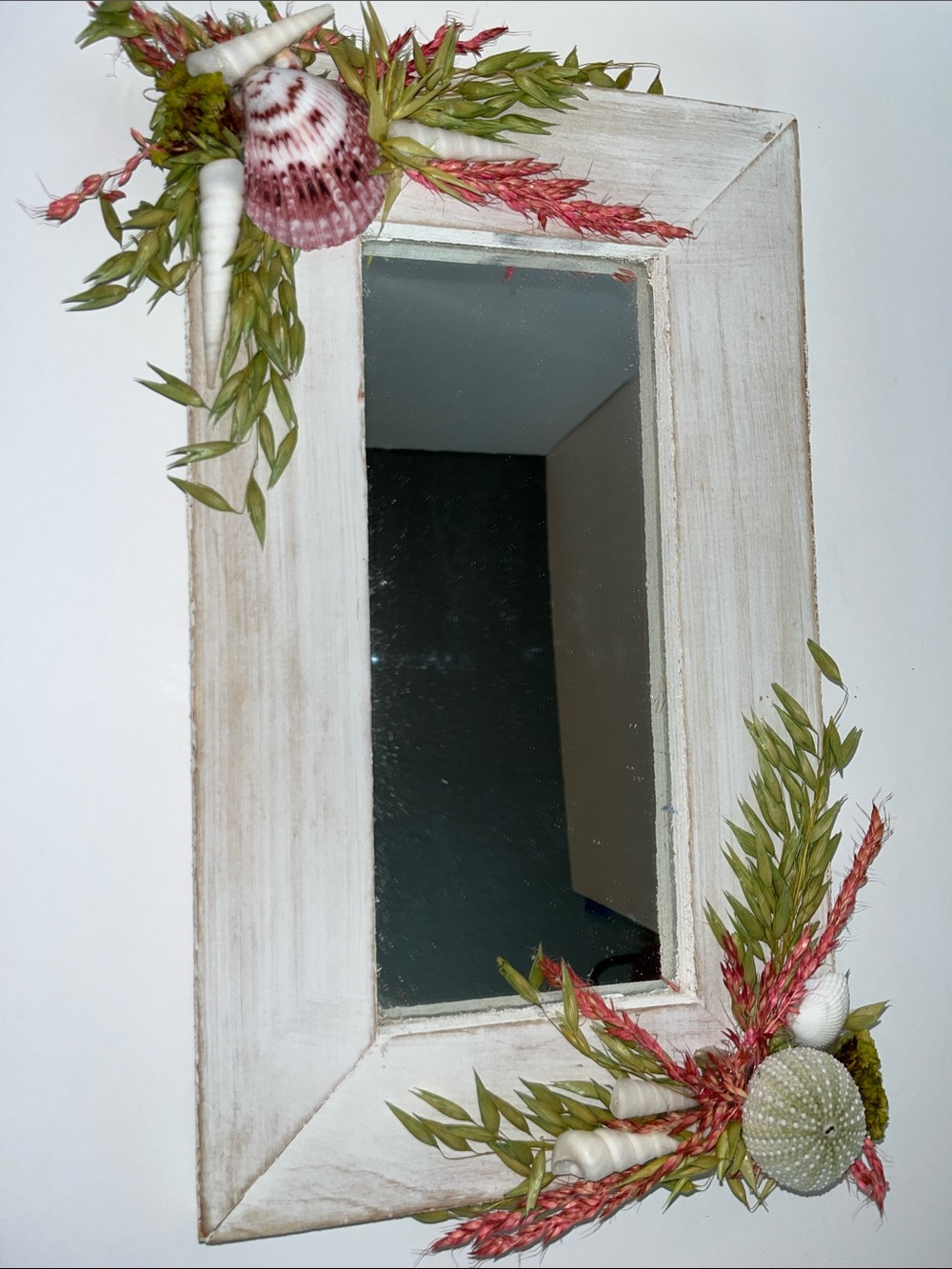 Coastal White Framed Wall Mirror with Pink Shell and Green Foliage Accents